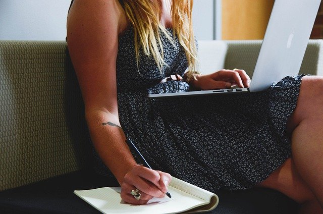 writing on laptop